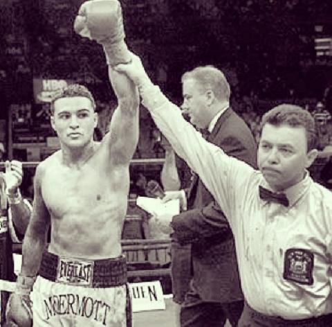 In 2005 at Madison Square Garden, famed Referee Benjy Estavez holds McDermotts hand in victory as ring announcer Joe Antonnacci reads the official result